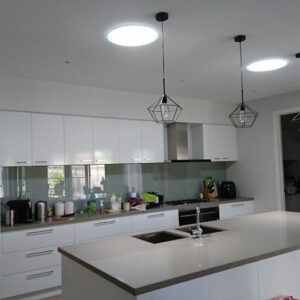White kitchen brightened by two Solatube ceiling diffusers