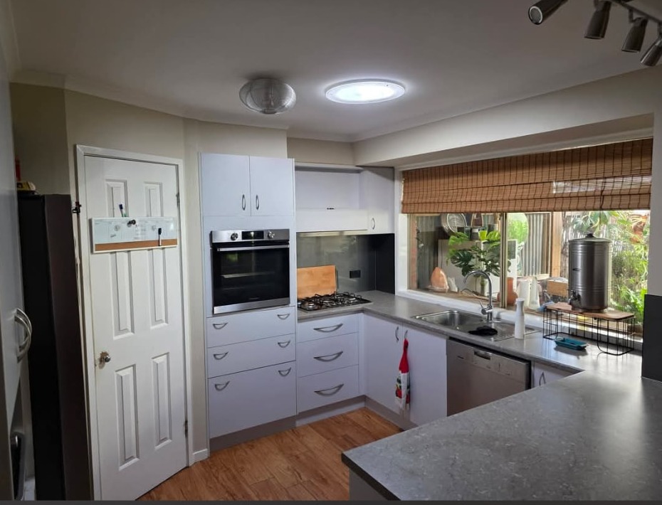 Kitchen brightened by a Solatube ceiling diffuser and roof ventilation fan